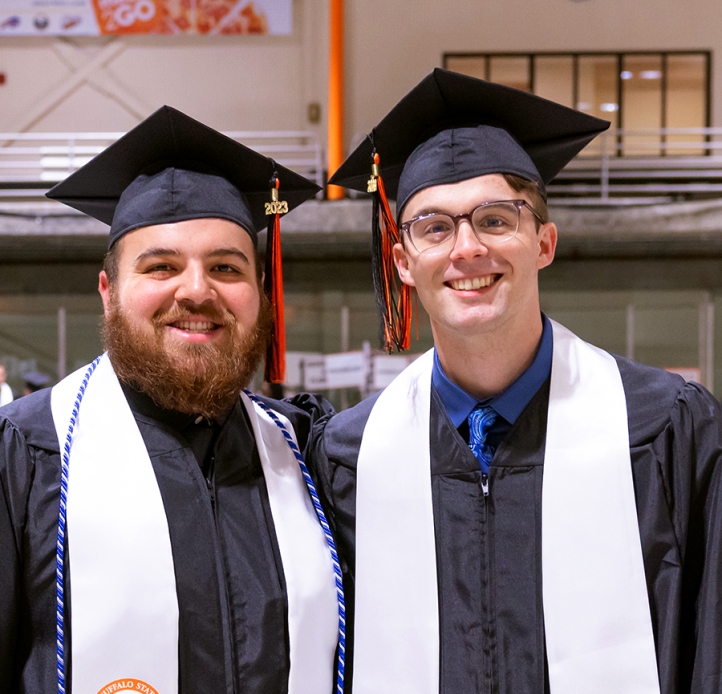 Two Commencement students smiling